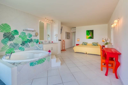 Bedroom with ocean view with bathtub